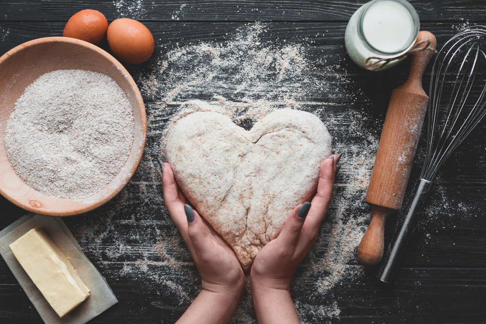 https://www.knightfrank.ie/wp-content/uploads/2022/09/woman-making-bread-heart-shape.jpg